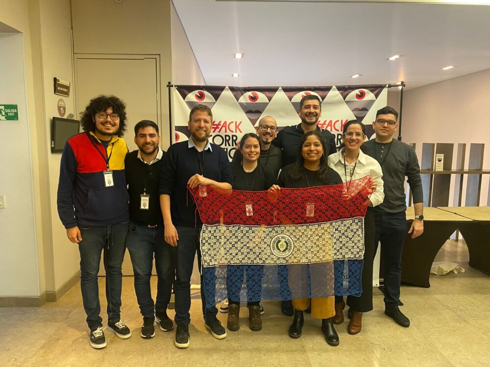 Photo: Participants smiling with the Paraguayan flag