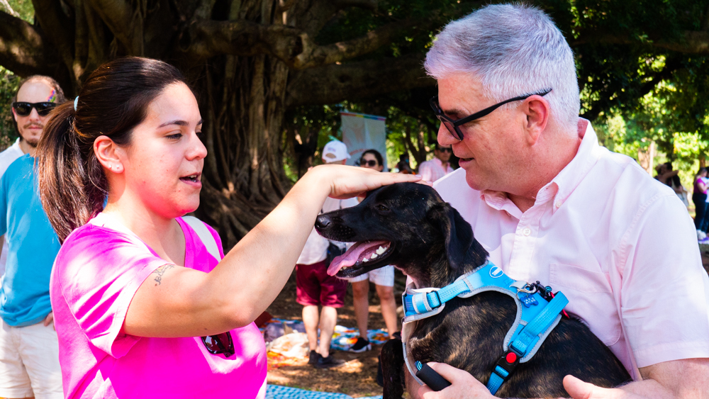 Deputy Johanna petting Ambassador Marc's pet